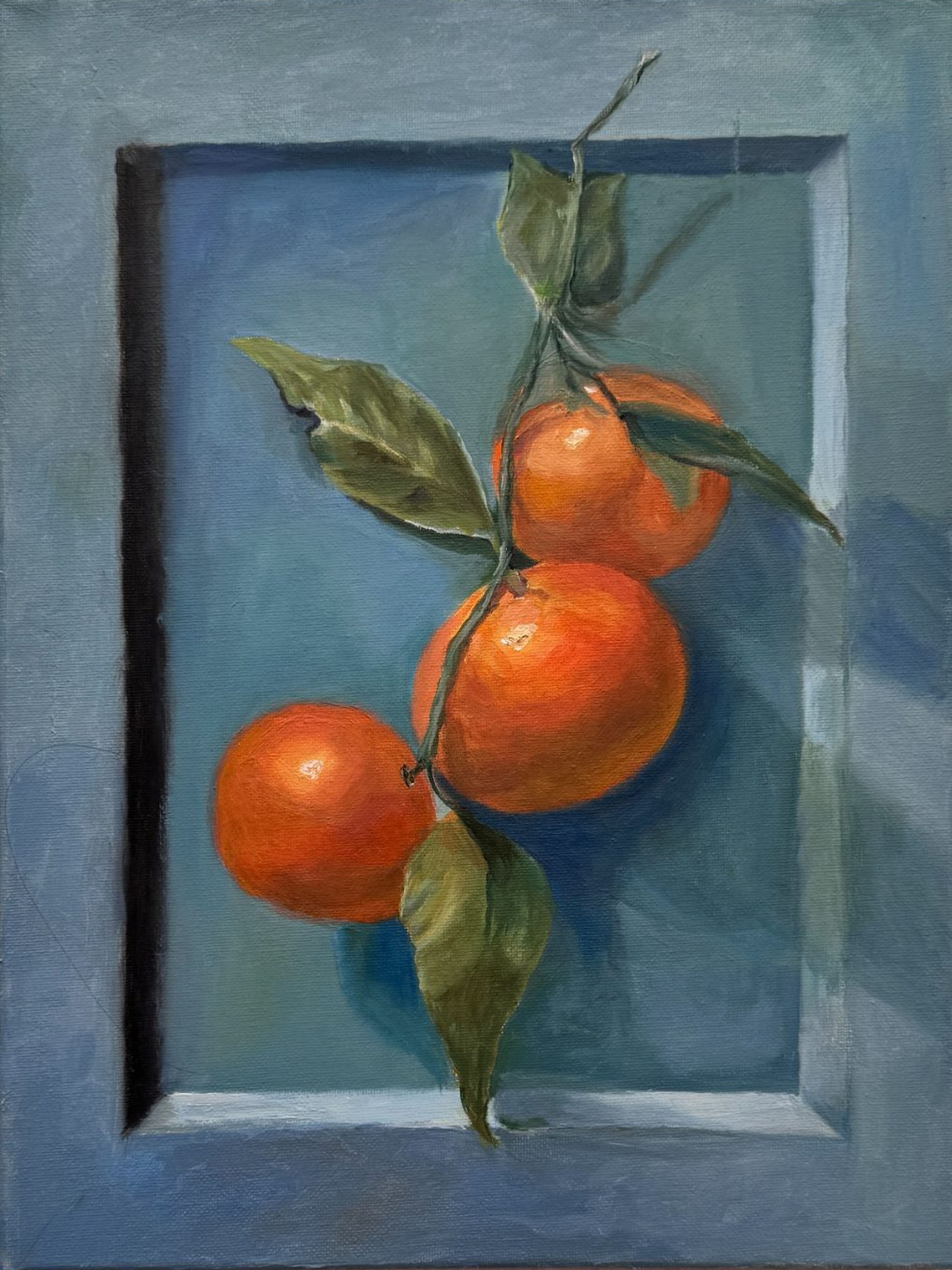 Three orange tangerines hanging from a branch against a blue background in an oil painting by Melodie Chiang.